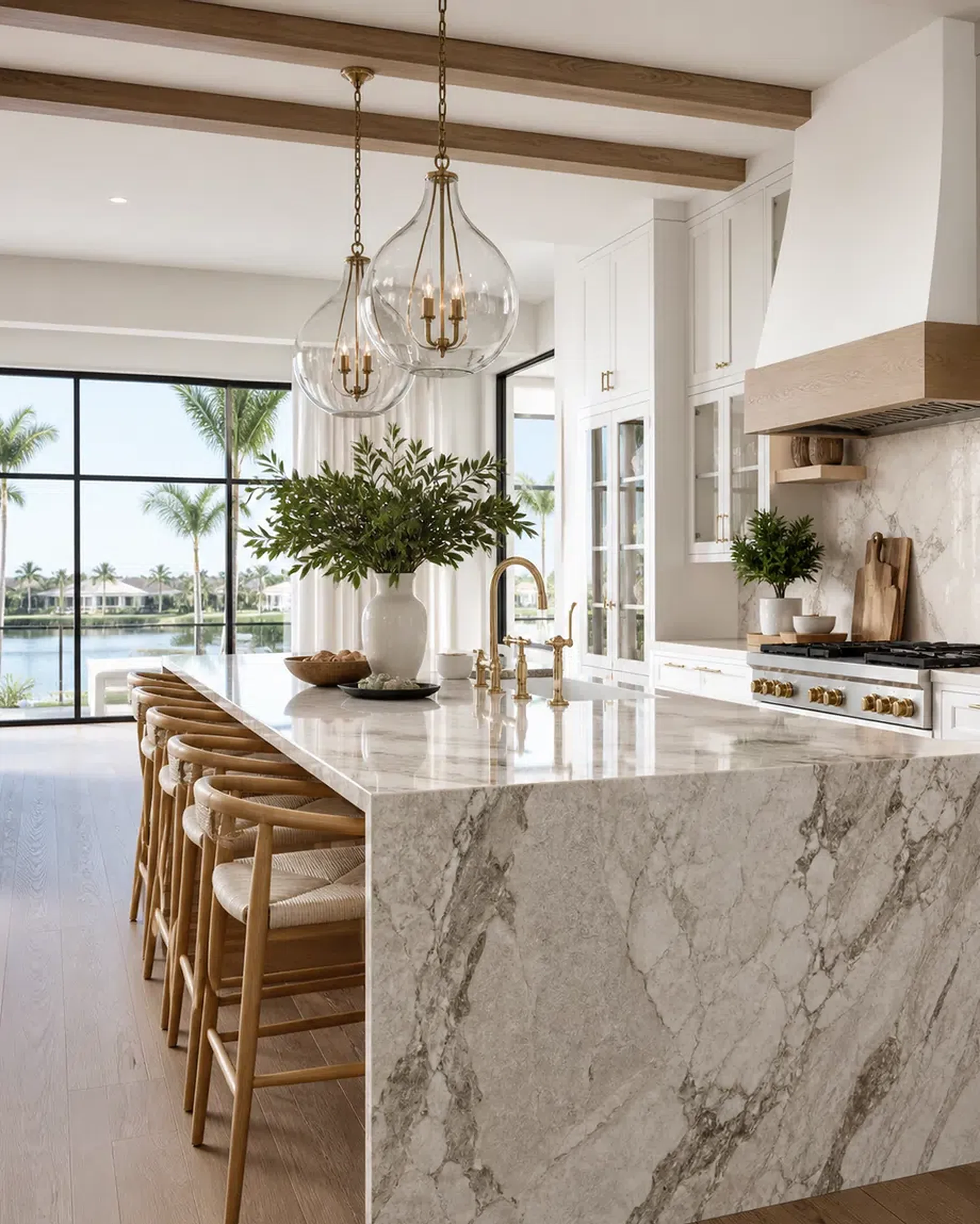 Luxury Boca Raton kitchen with cabinet storage, quartzite-style island, and brass accents