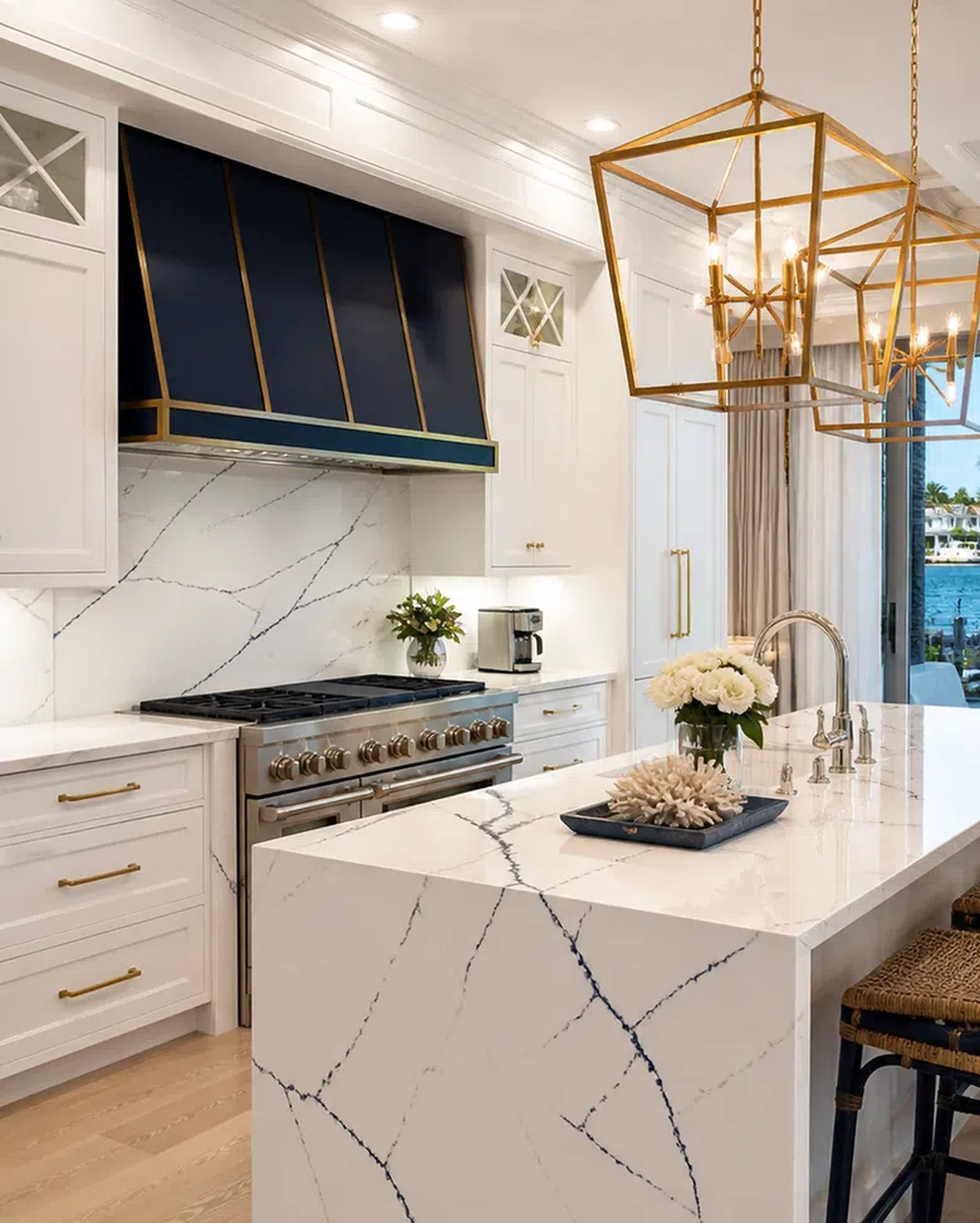 Bright Lake Worth kitchen remodel with large island, cabinet storage, and stone surfaces