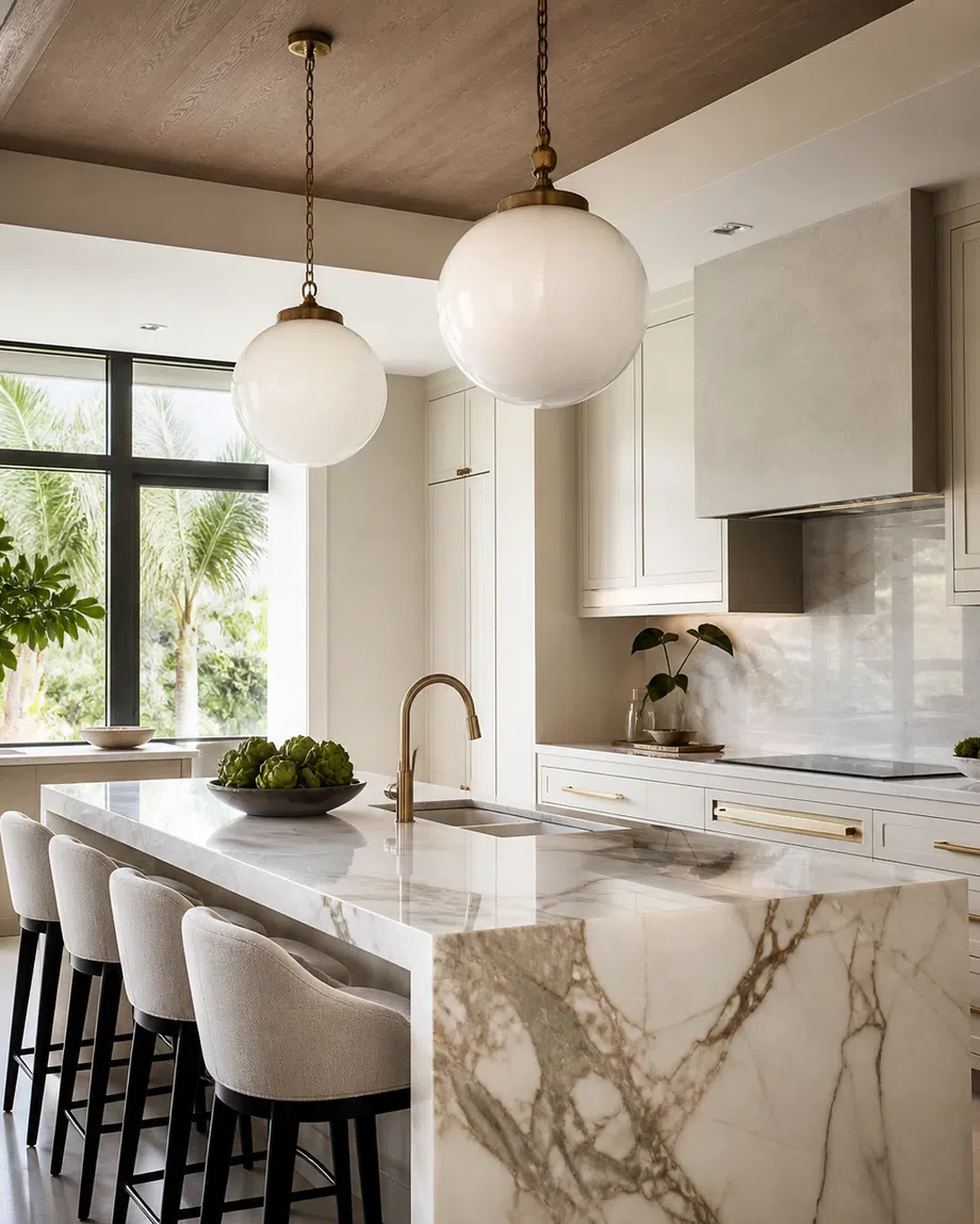 Luxury Loxahatchee kitchen with cabinet storage, quartzite-style island, and brass accents
