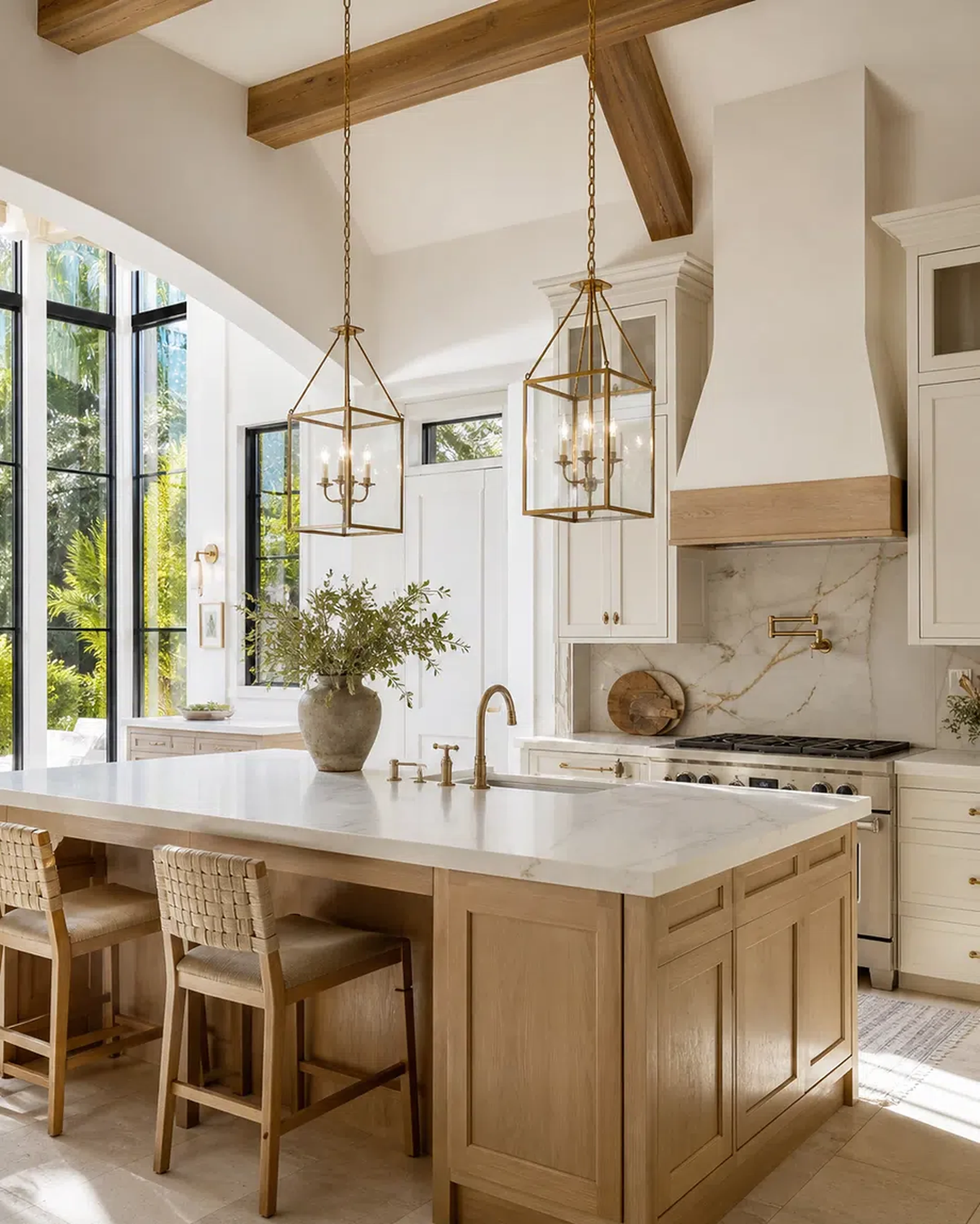 Luxury Palm Beach Gardens kitchen with cabinet storage, quartzite-style island, and brass accents
