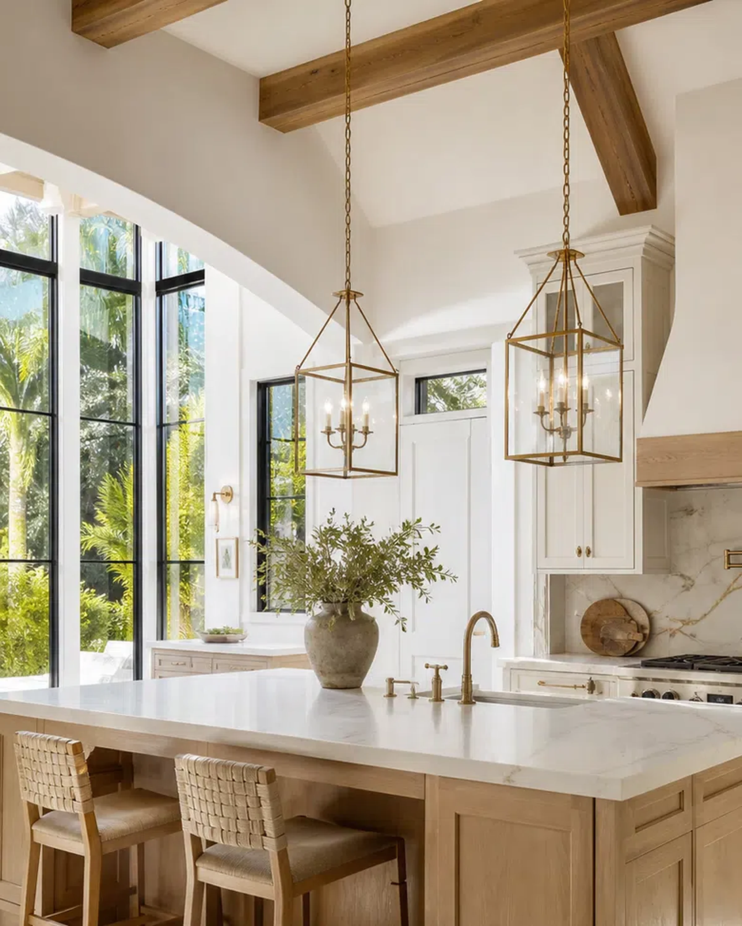 Bright Palm Beach Gardens kitchen remodel with large island, cabinet storage, and stone surfaces