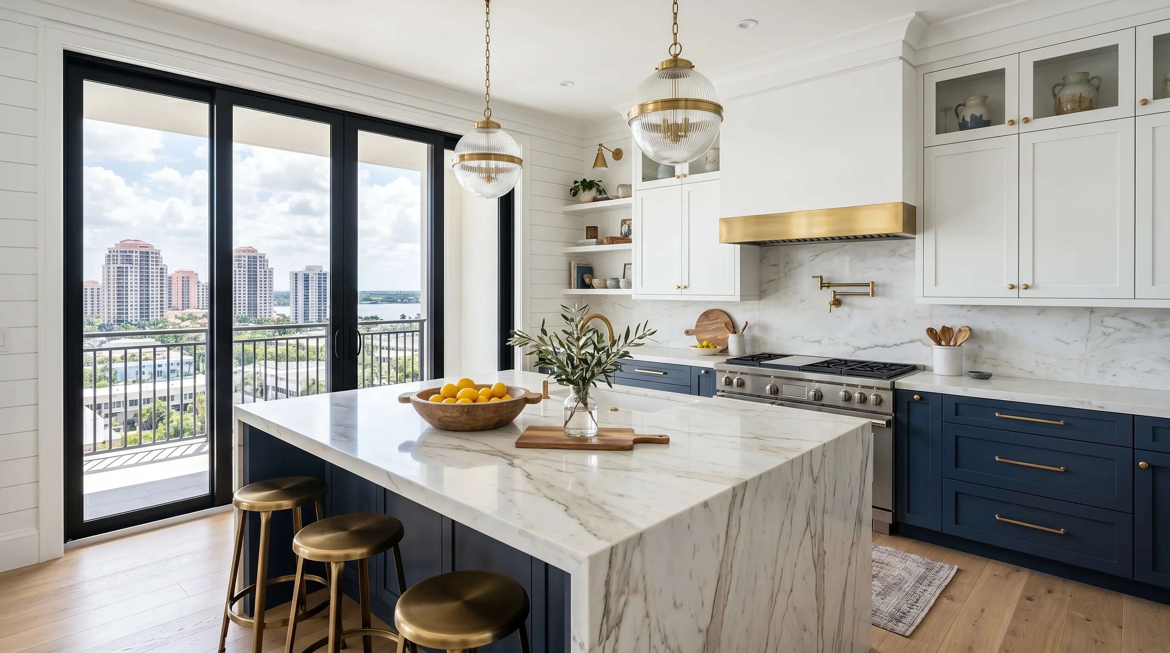 Upscale West Palm Beach kitchen island design with premium stone counters and warm lighting