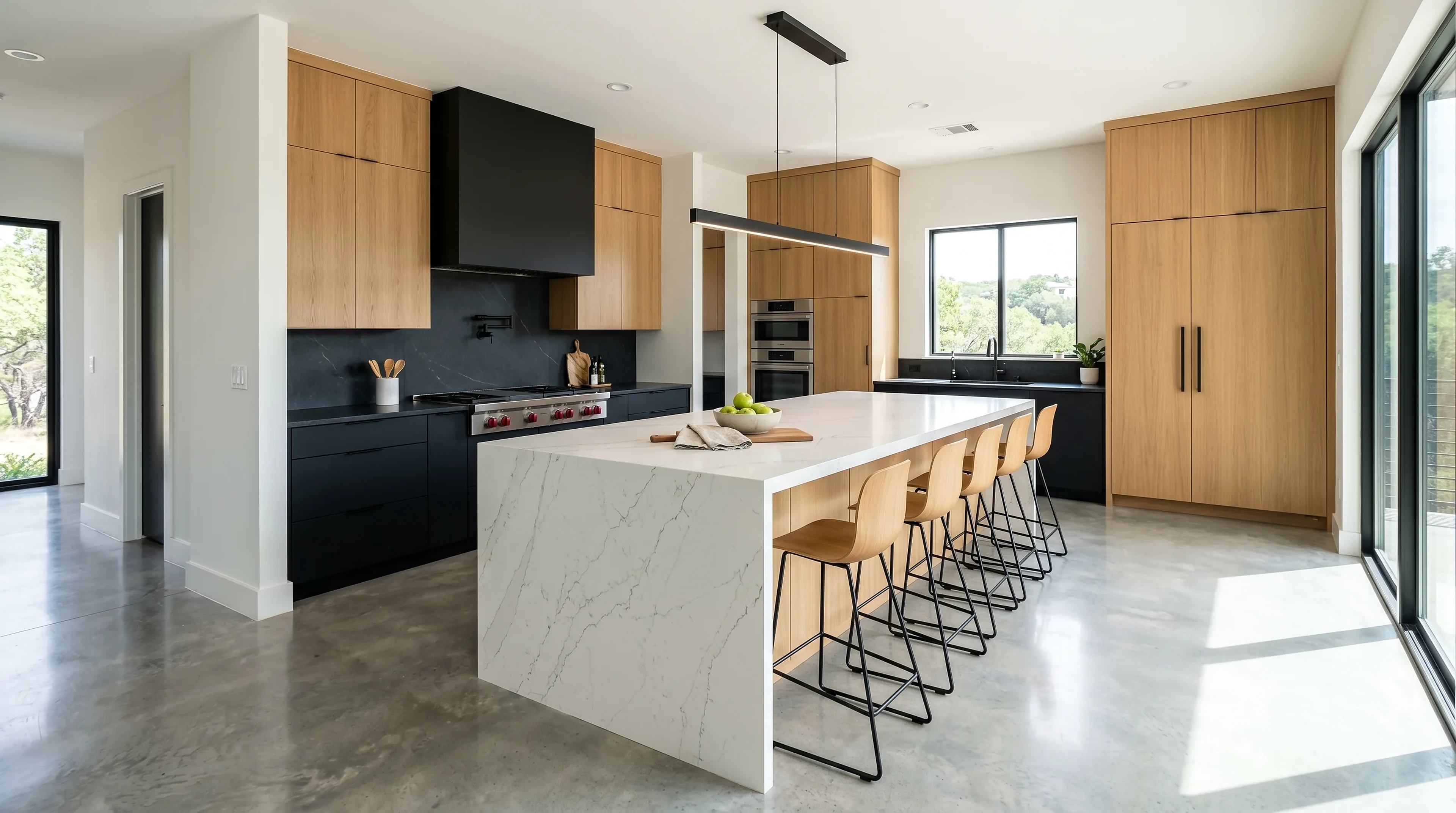 High-end Westlake kitchen remodel with custom cabinetry and a stone waterfall island
