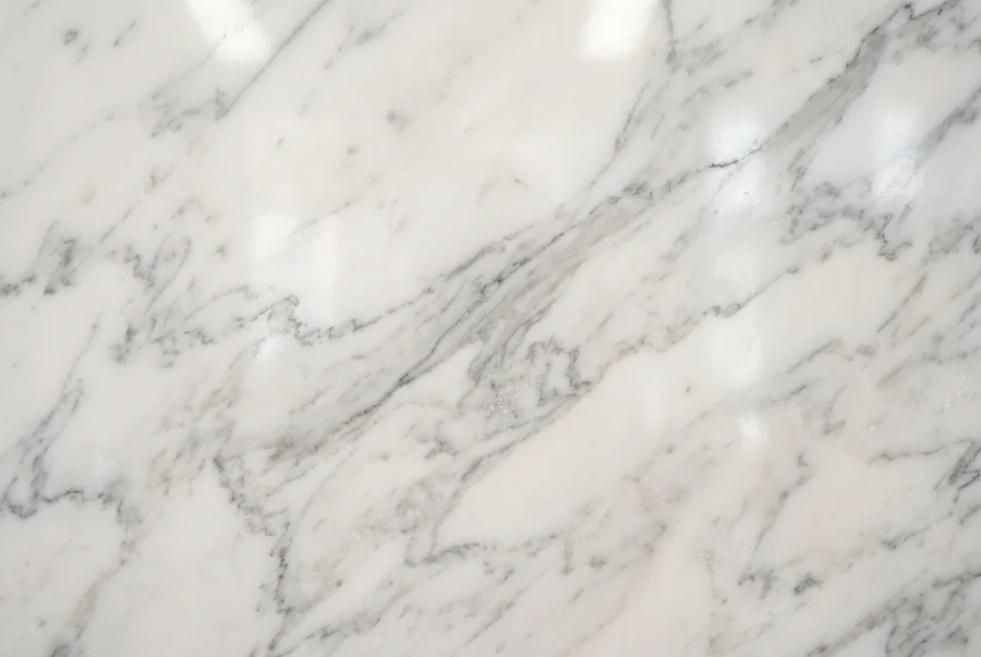 Polished Carrara marble slab with gray veining